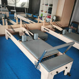 Pilates Reformer con resortes de resistencia intercambiables