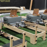 Pilates Reformer con correas y manillas para trabajo de brazos